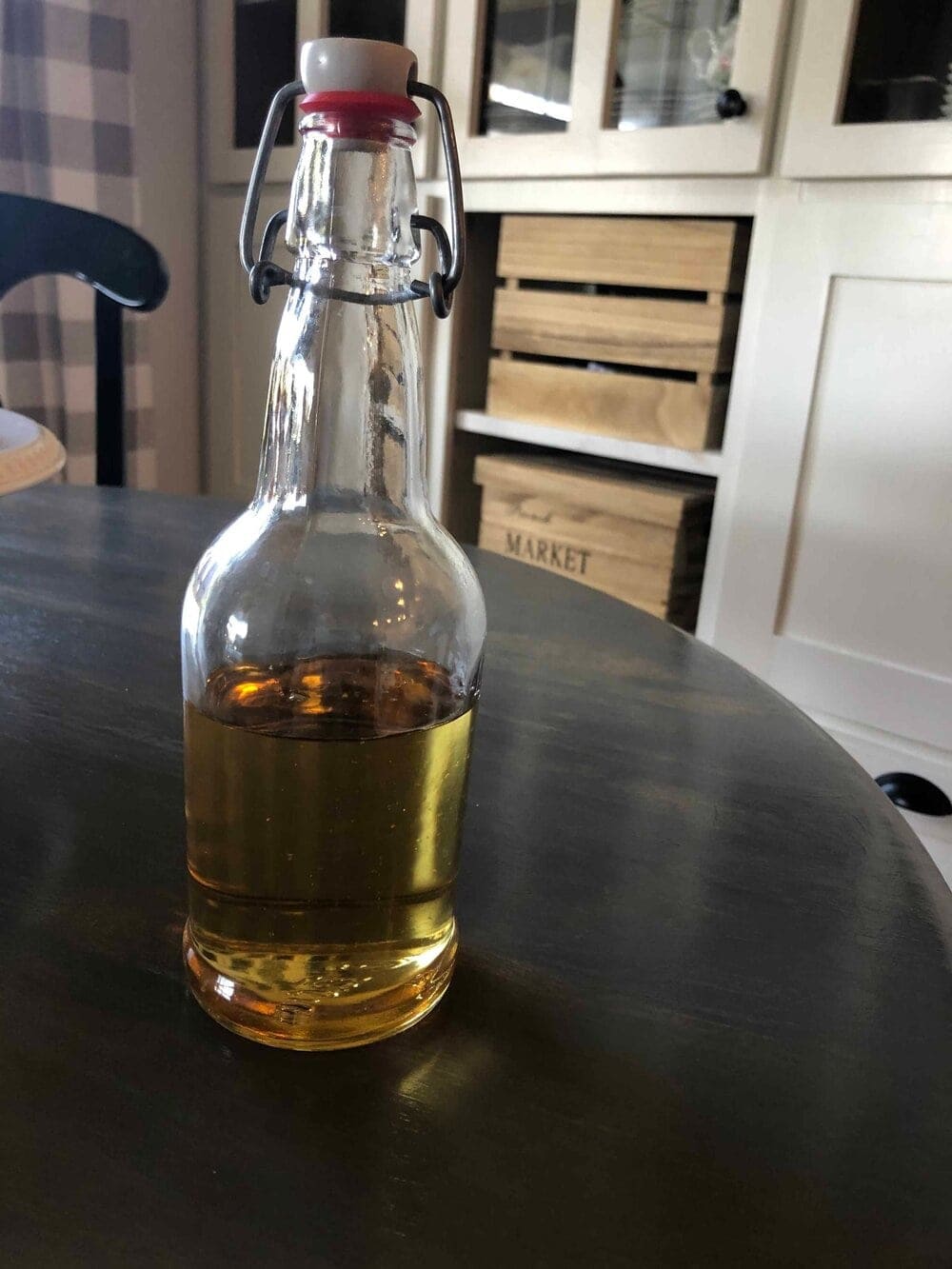 homemade chili simple syrup in a glass bottle