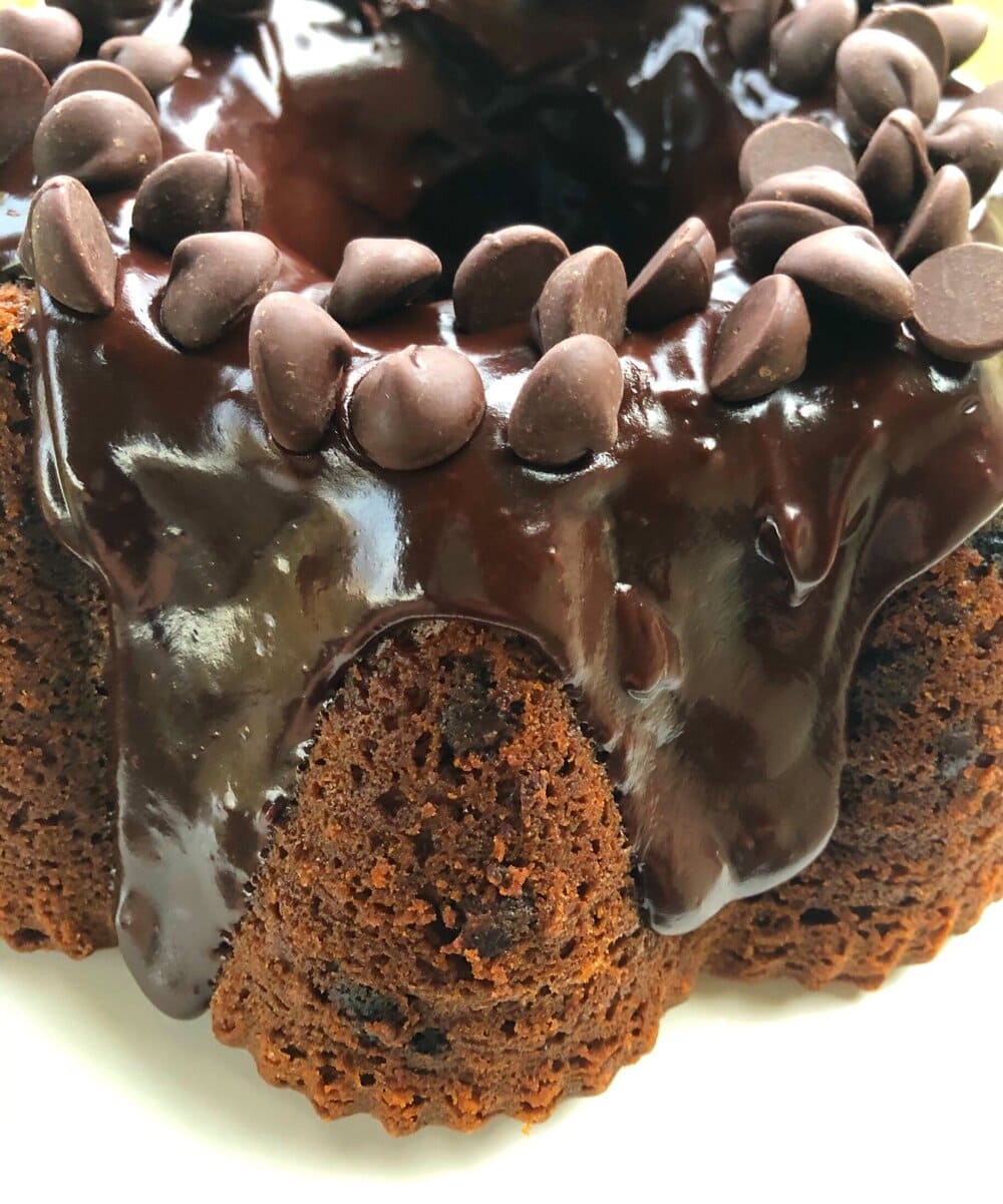A chocolate cake filled with dried cherries and topped with chocolate ganache. This cake is so amazing. It is moist, delicious, versatile, and fool-proof. It’s perfect for dessert or for a holiday party. #chocolatecherrycake #chocolatecake #dessert #cake #Missourigirl