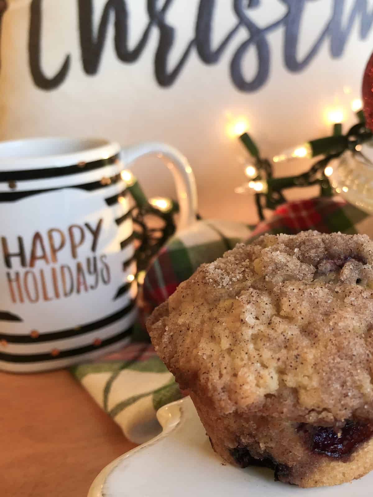 holiday blueberry streusel muffin with Christmas decor in the background