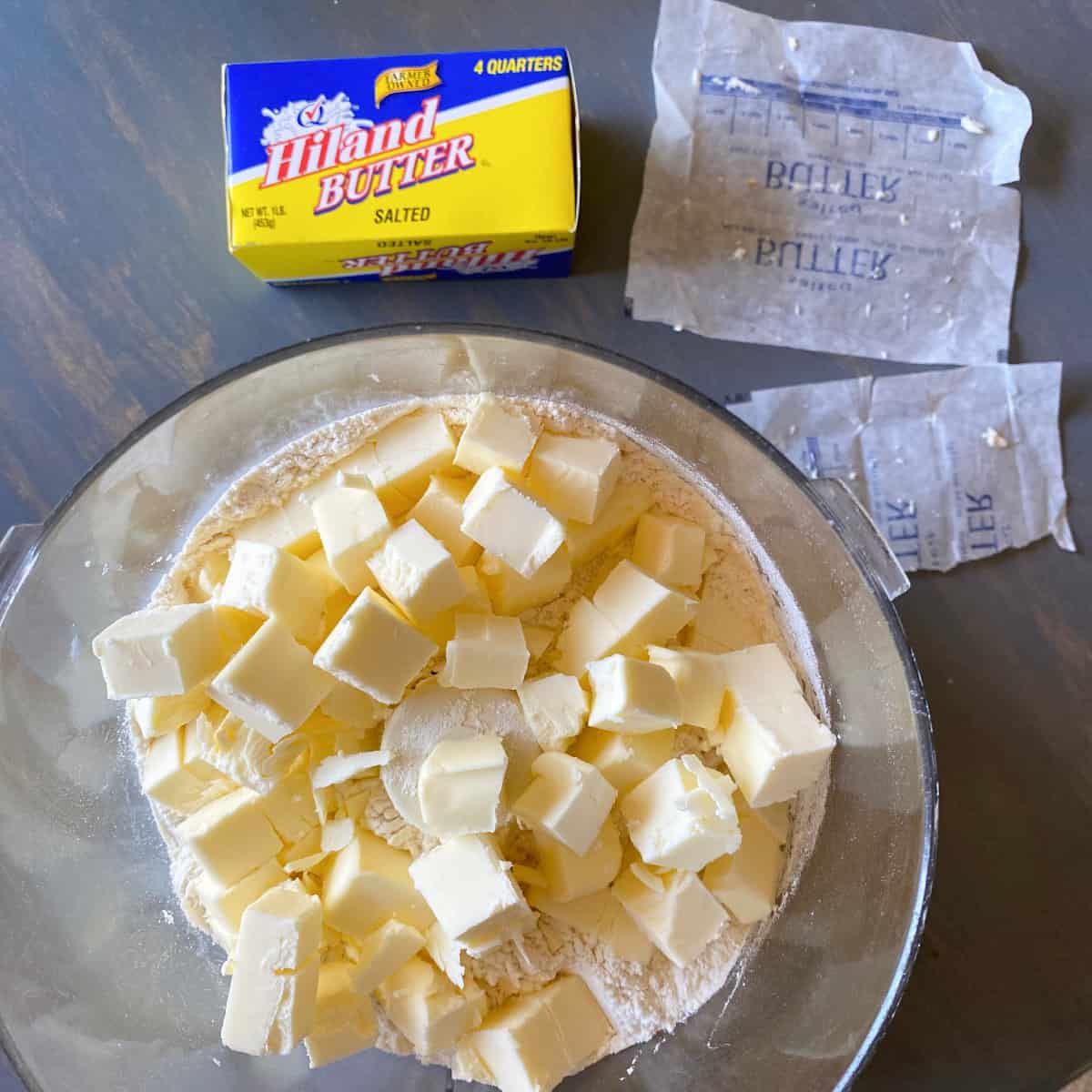 cubes of Hiland Dairy butter in a food processor in preparation for making homemade rough puff pastry